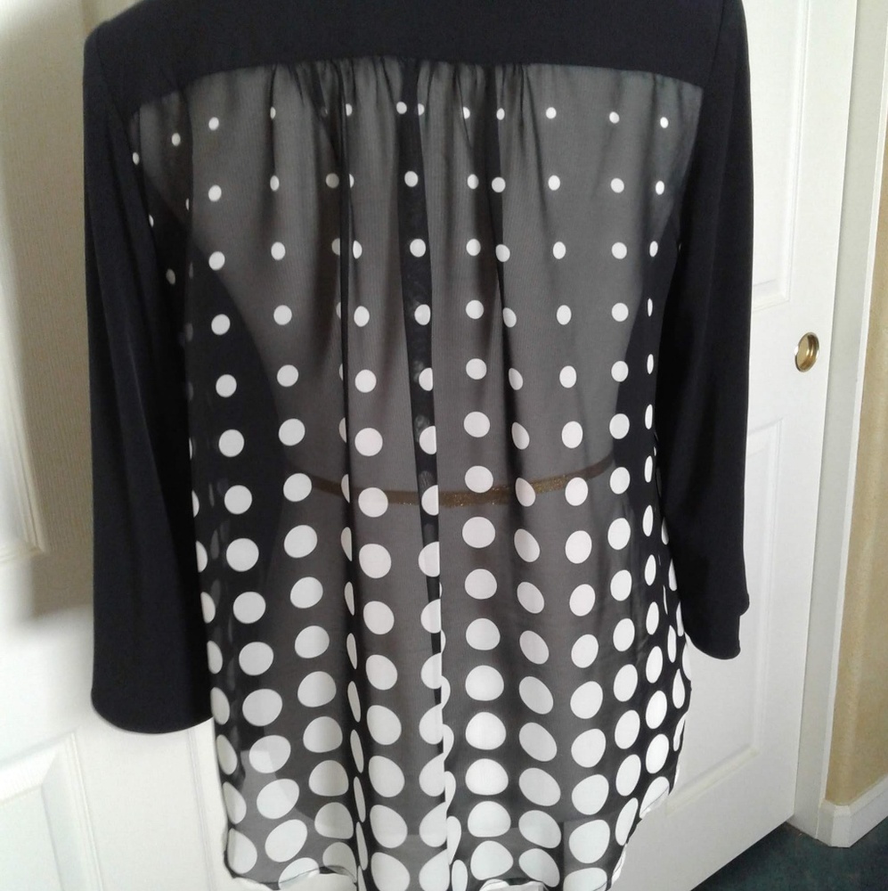 Knit swing blazer with sheer back.